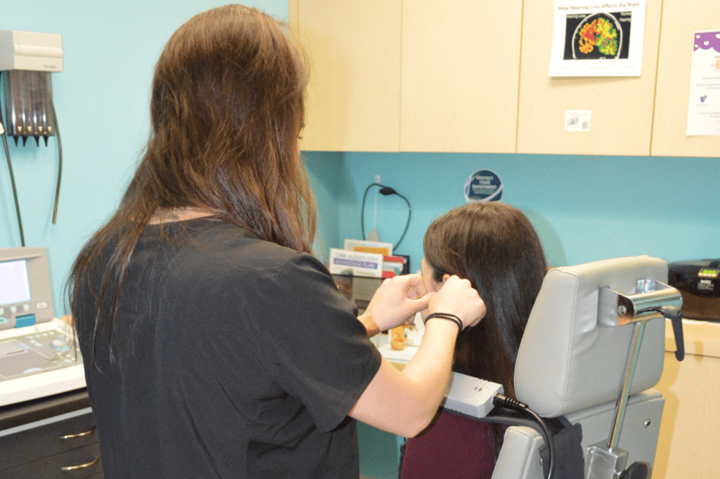 audiologist taking an ear impression