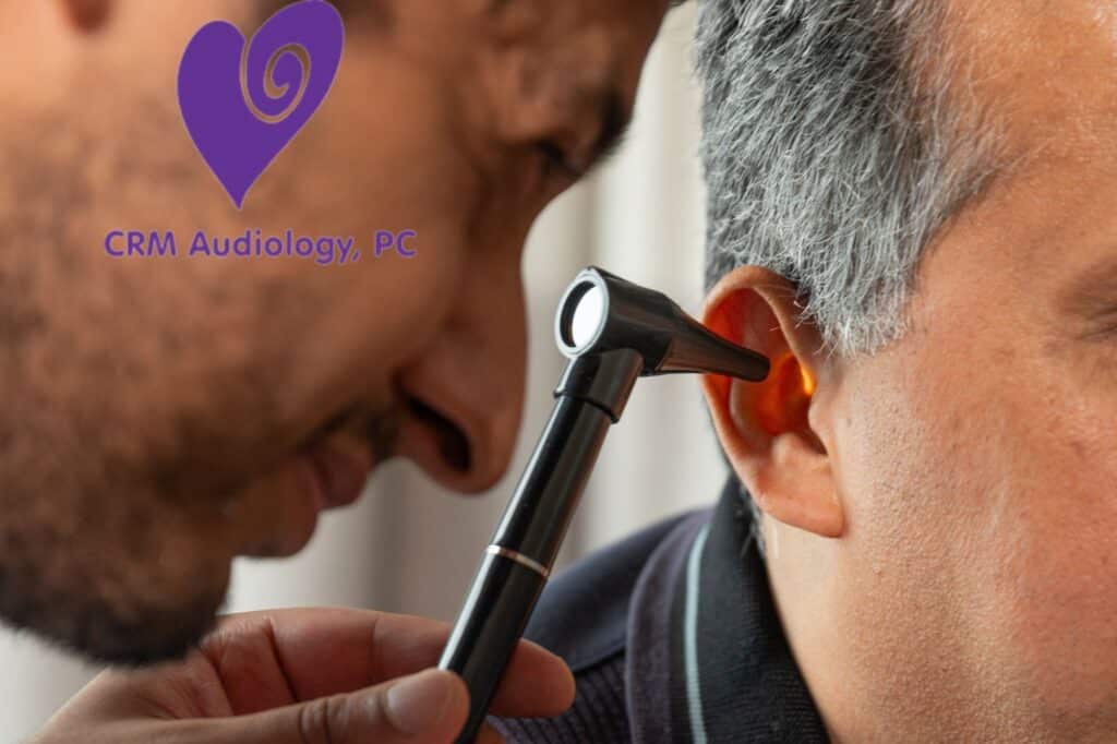 doctor looking in patients ear