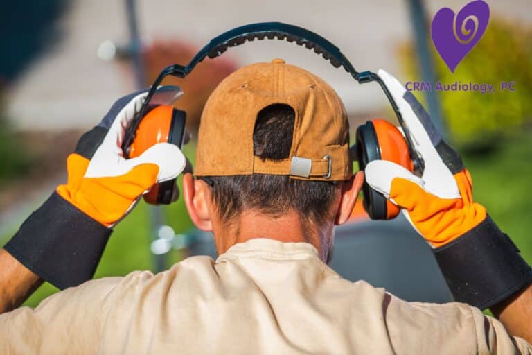 worker putting on ear protection