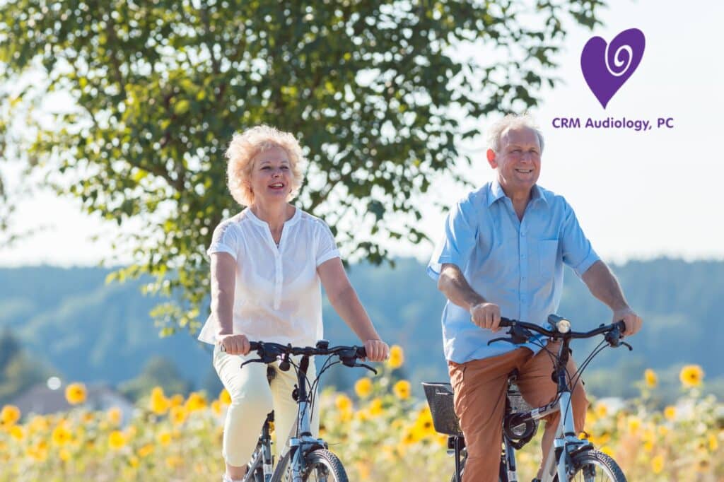 elderly couple riding bicycles