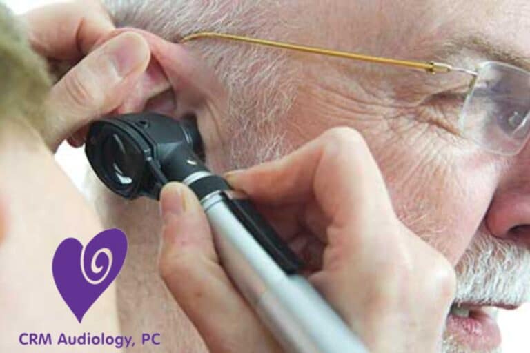 otoscope looking in a man's ear