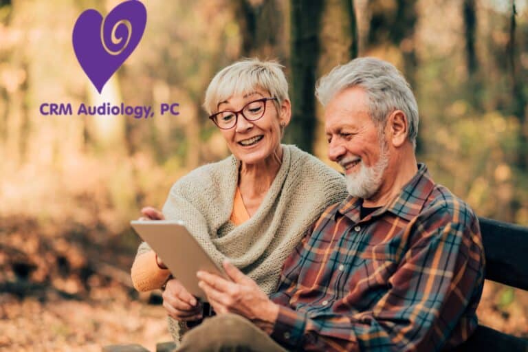 older couple reading on a bench