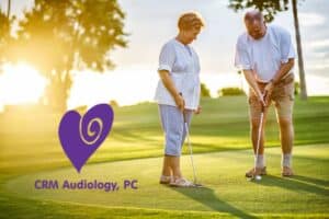 an older couple playing golf