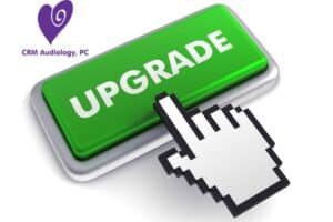 green upgrade button with a finger about to push it