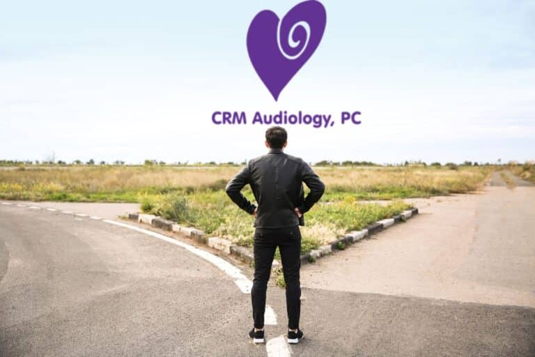 man standing at a fork in the road