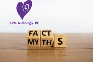 wooden blocks changing the word myths to the word facts