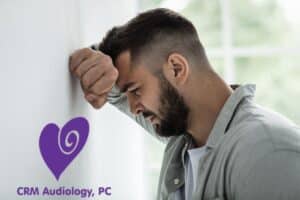 mad leaning against the wall dealing with sadness