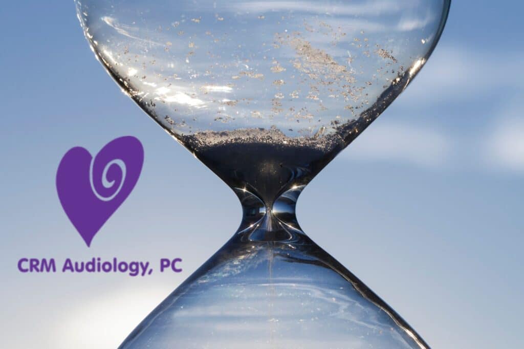 sand running through an hourglass