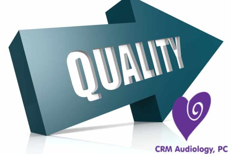 a blue arrow with the word quality