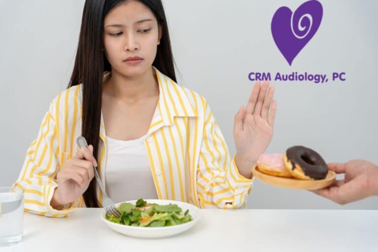 woman eating a salad and saying no to donuts
